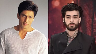 Shah Rukh Khan and Zayn Malik pose together at a public event, showcasing their style and charisma.
