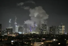 Smoke rising over Tel Aviv skyline after missile attack, June 13, 2025.