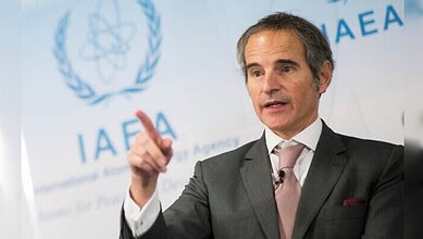 Rafael Grossi speaking at an IAEA event, gesturing during a press briefing.
