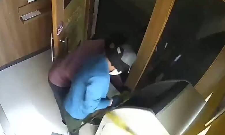 Thieves dragging away IDFC Bank ATM using a Bolero vehicle in Andhra Pradesh.