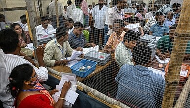 Election officials counting votes during West Bengal assembly elections.