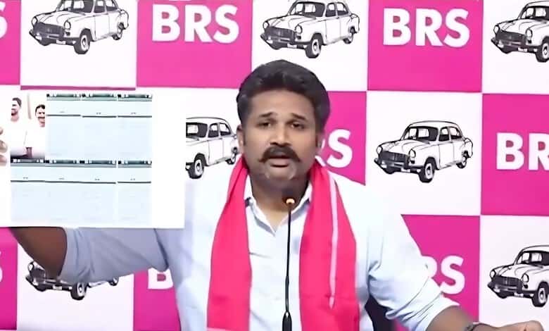 A man holding a newspaper in front of a pink and white BRS logo backdrop.
