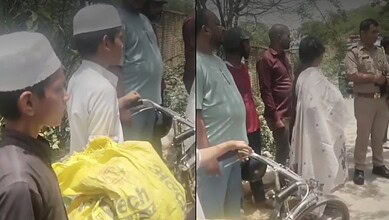 A young boy with a bicycle and a yellow bag, surrounded by adults and police officers outdoors.