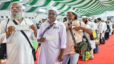 Haj pilgrims waiting in line at registration for travel amid government easing burden.