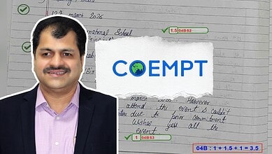 Accessible, professional portrait of a man in a suit with a background featuring handwritten notes and th.