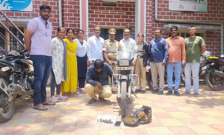 The Siasat Daily: Group of people, including police officers and civilians, gathered around a motorcycle.