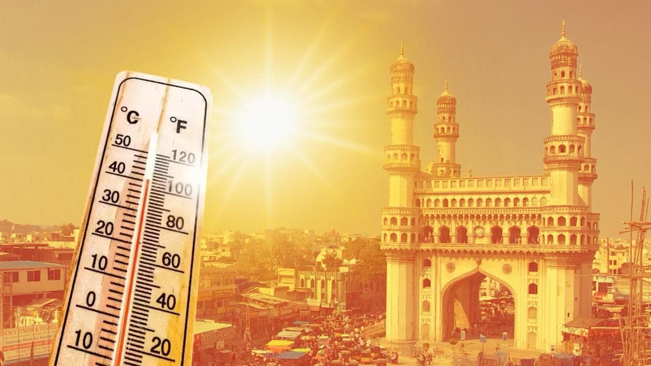 Thermometer showing high temperature at sunset with historic cityscape in the background.