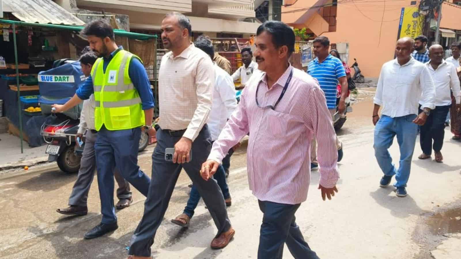 Officials inspecting waterlogging in Jubilee Hills area, led by MLA and GHMC chiefs, to address flooding.