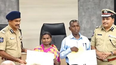 The image shows Maoist leaders Narahari (second from right) and his wife Danamma (second from left), accepting reward cheques from DGP CV Anand during their surrender in Hyderabad on Tuesday, May 26, 2026.