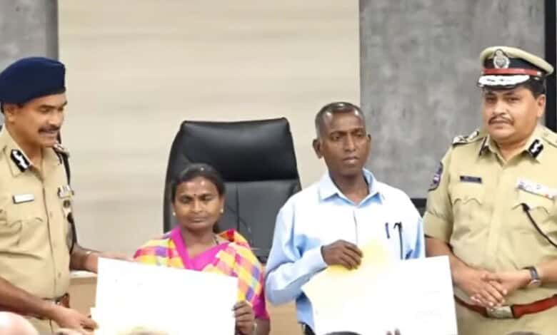 The image shows Maoist leaders Narahari (second from right) and his wife Danamma (second from left), accepting reward cheques from DGP CV Anand during their surrender in Hyderabad on Tuesday, May 26, 2026.