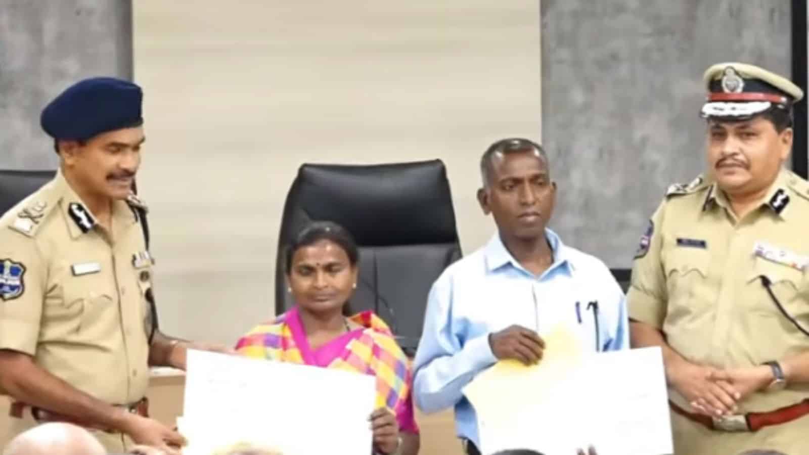 The image shows Maoist leaders Narahari (second from right) and his wife Danamma (second from left), accepting reward cheques from DGP CV Anand during their surrender in Hyderabad on Tuesday, May 26, 2026.