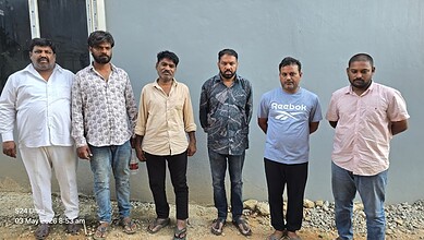 Victims of fake plot registration scam in Hyderabad, including a retired man, stand together after the bu.
