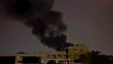 Large black smoke billows from a fire at a scrap yard in Hyderabad's Musheerabad area.