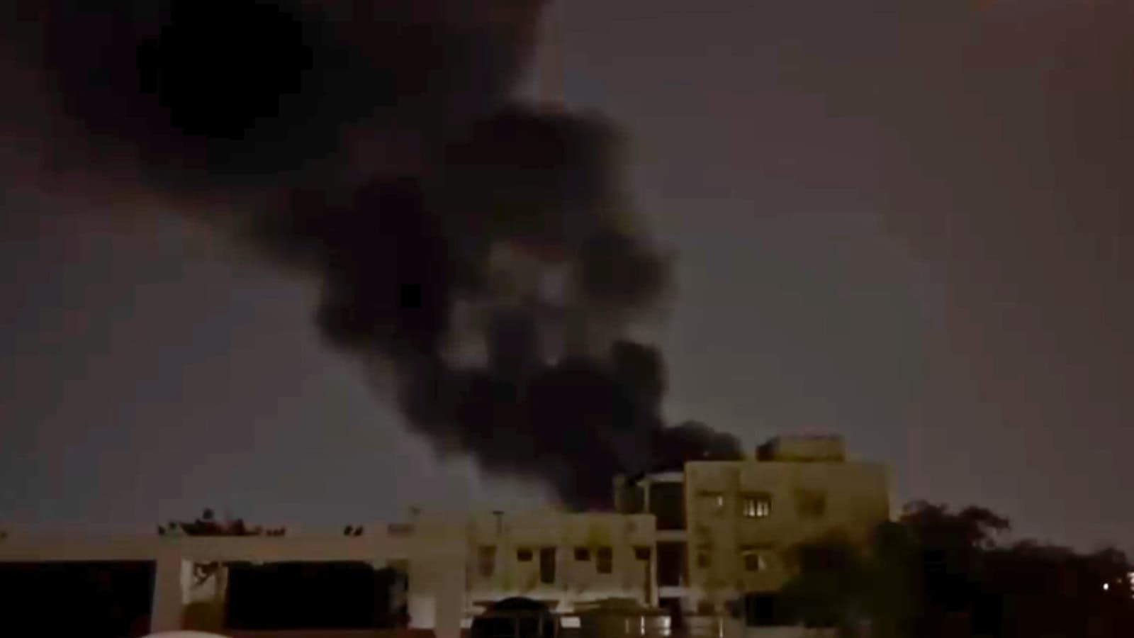 Large black smoke billows from a fire at a scrap yard in Hyderabad's Musheerabad area.