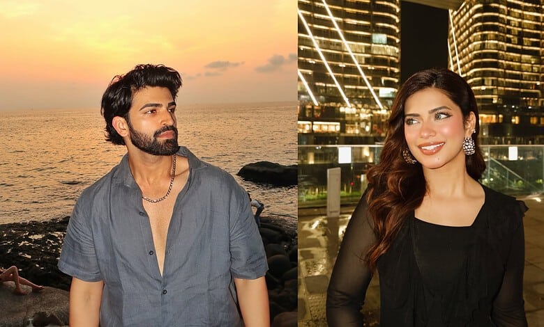 A young man gazing at the sunset by the sea and a young woman smiling in front of illuminated skyscrapers.