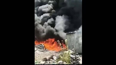 Fire erupts at plastic warehouse in Kothapet, with thick black smoke and flames engulfing the site. Emerg.