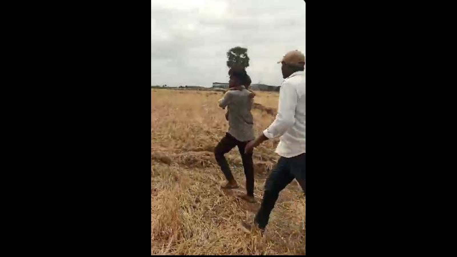 villagers take boy to safety after he was rescued from the borewell in Nalgonda