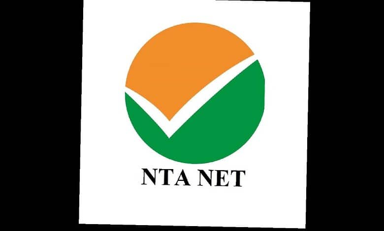 The NTA NET logo featuring a checkmark within a circular design in orange, green, and white colours.