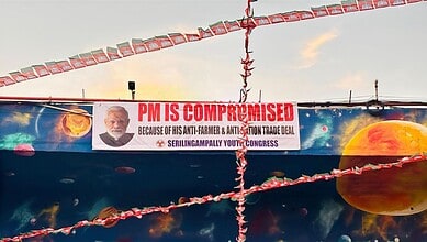 PM is compromised posters banner with image of Prime Minister, anti-farmer message, and political campaig.