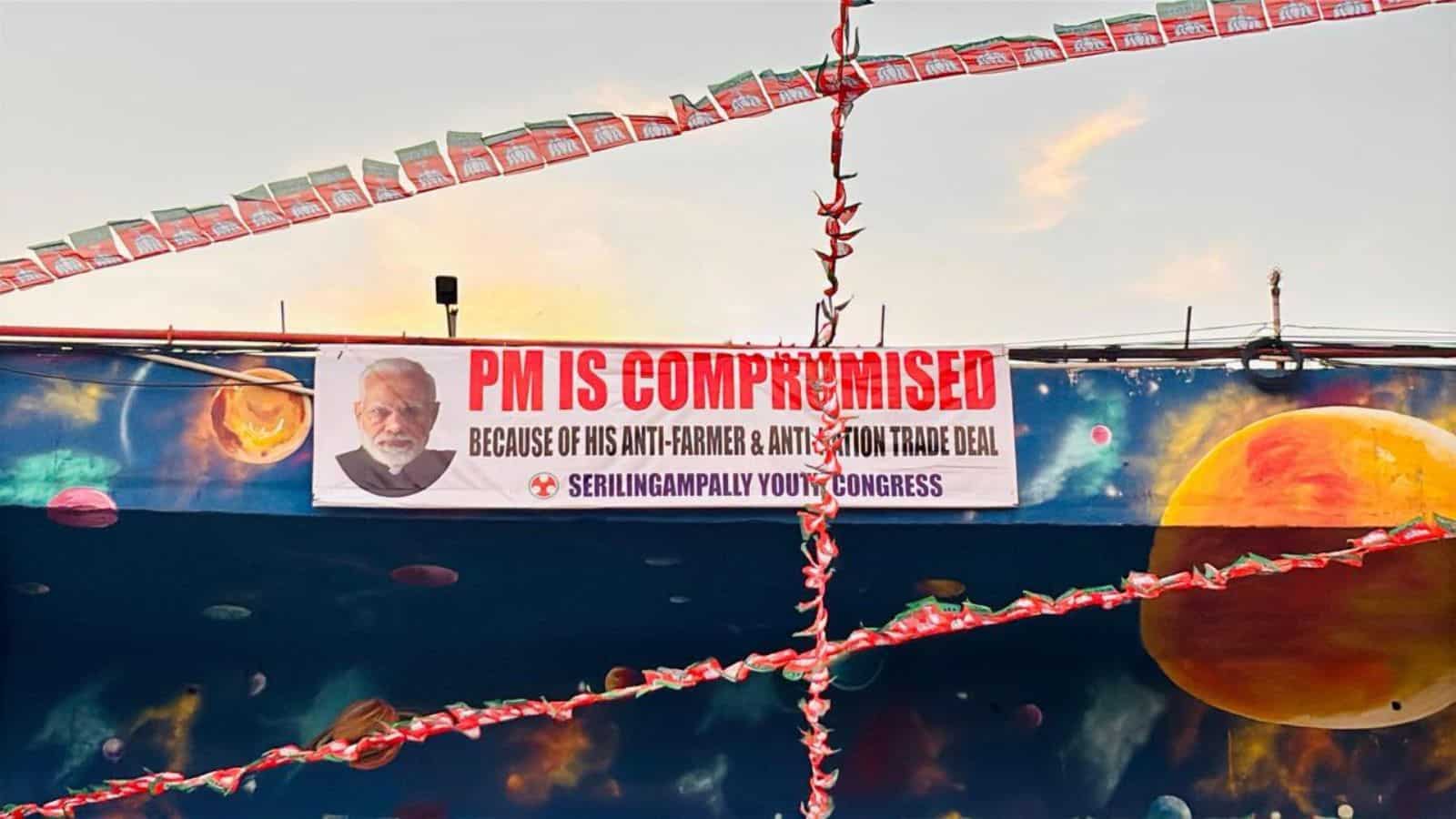 PM is compromised posters banner with image of Prime Minister, anti-farmer message, and political campaig.