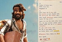 Ram Charan smiling with a letter to Peddi team, promoting upcoming movie release and fan engagement in Te.