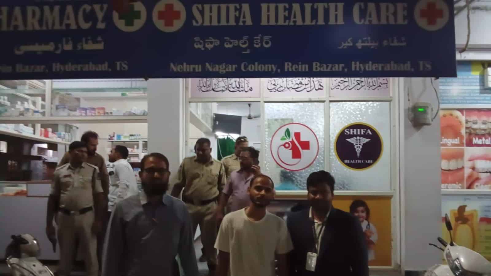 Affordable Shifa Health Care pharmacy in Hyderabad with staff and customers outside the store.