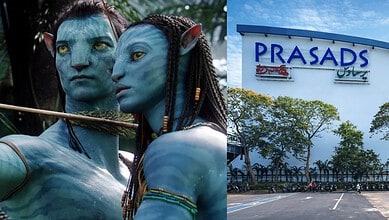 Two Avatar-inspired characters with blue skin and elaborate costumes outside Prasads Mall, Hyderabad.
