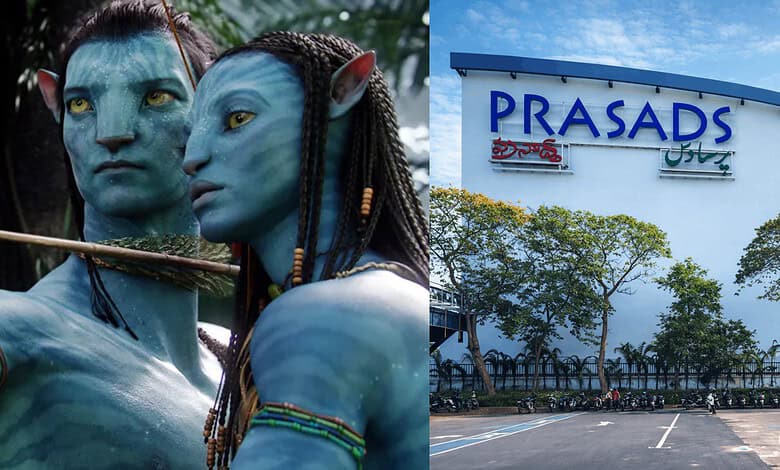 Two Avatar-inspired characters with blue skin and elaborate costumes outside Prasads Mall, Hyderabad.
