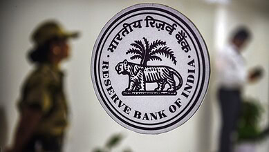 Reserve Bank of India emblem featuring a tiger and palm tree.