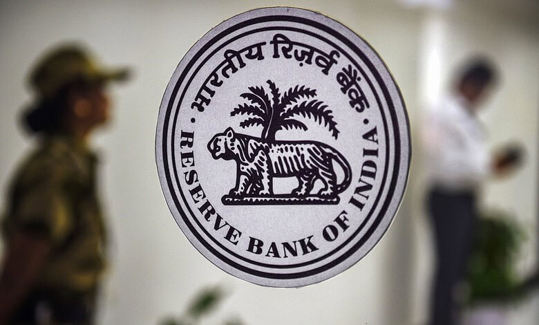 Reserve Bank of India emblem featuring a tiger and palm tree.
