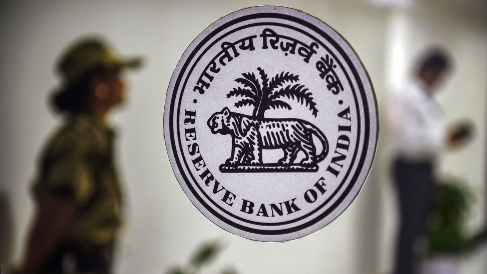 Reserve Bank of India emblem featuring a tiger and palm tree.