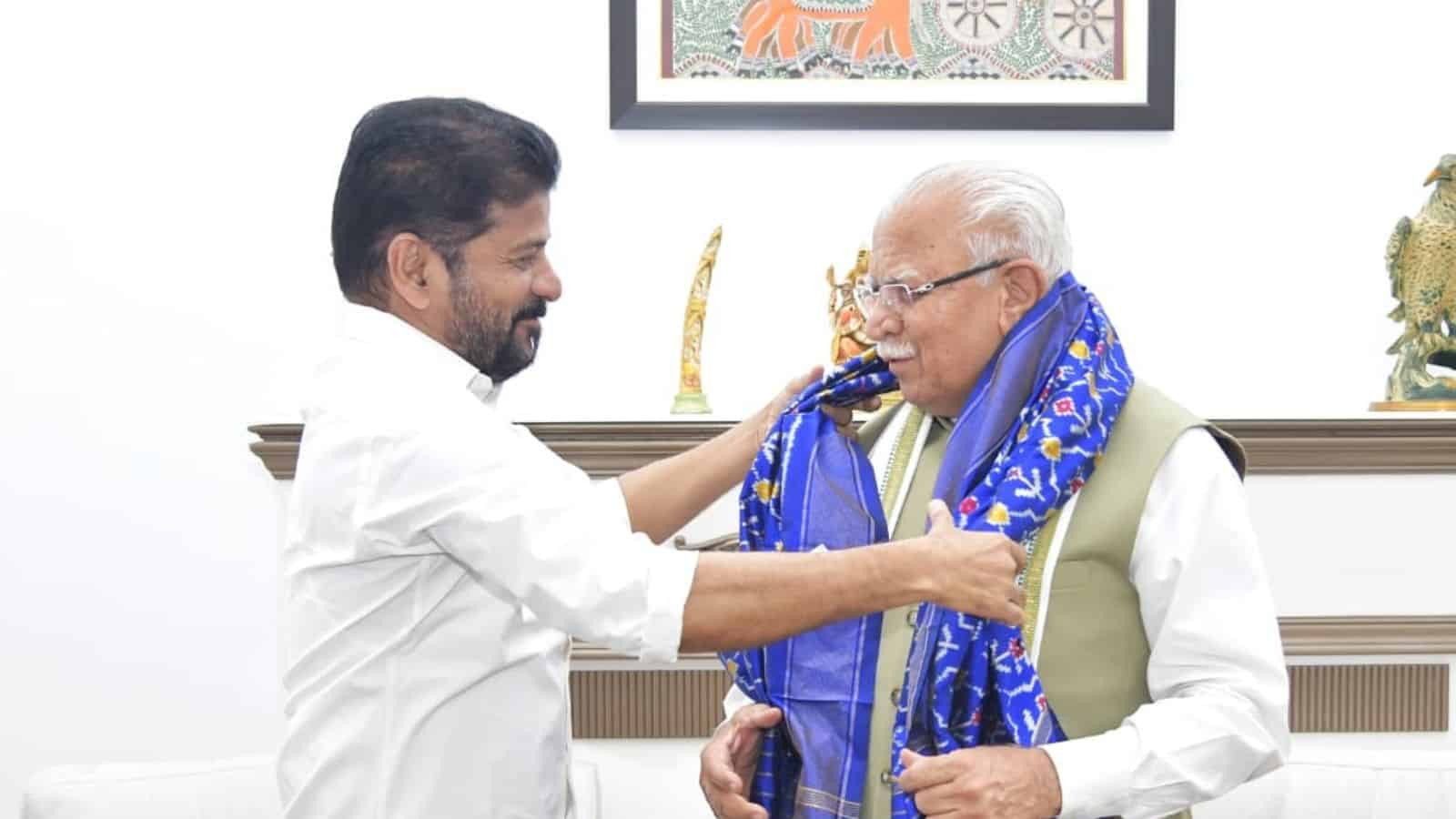The image shows Telangana CM A Revanth Reddy meeting Union Minister for Urban Affairs Manohar Lal Khattar in Delhi to discuss Hyderabad Metro project's Phase 2 and 3 on Wednesday, May 6, 2026.