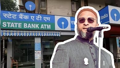 A man speaking into a microphone outside a State Bank ATM in India.