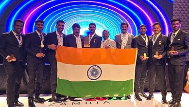 Singareni rescue team members holding the Indian flag after winning at an international competition in Za.