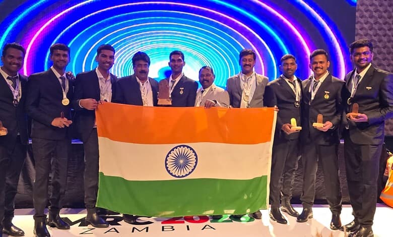 Singareni rescue team members holding the Indian flag after winning at an international competition in Za.