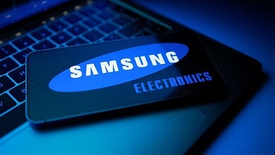 Samsung electronics smartphone on keyboard, highlighting AI-driven growth and chip demand.