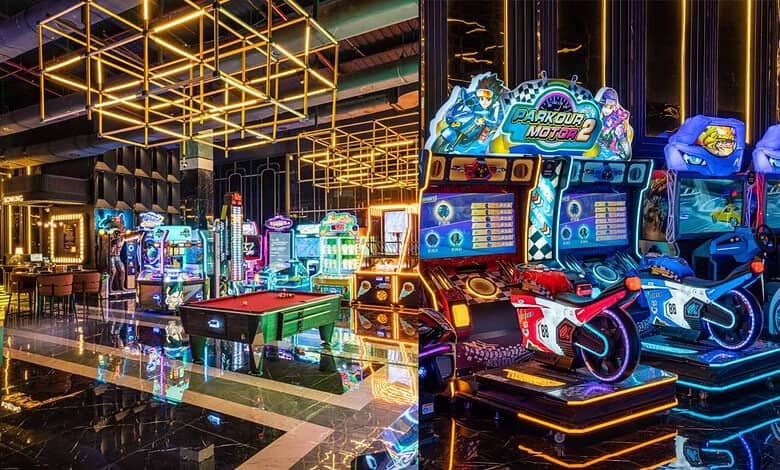 Brightly lit arcade with racing and shooting games, modern decor, and vibrant neon lights at Hyderabad's.