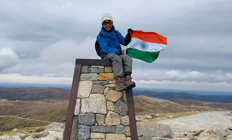 Young boy from Siddipet, Telangana, holding Indian flag at Australia's highest peak.