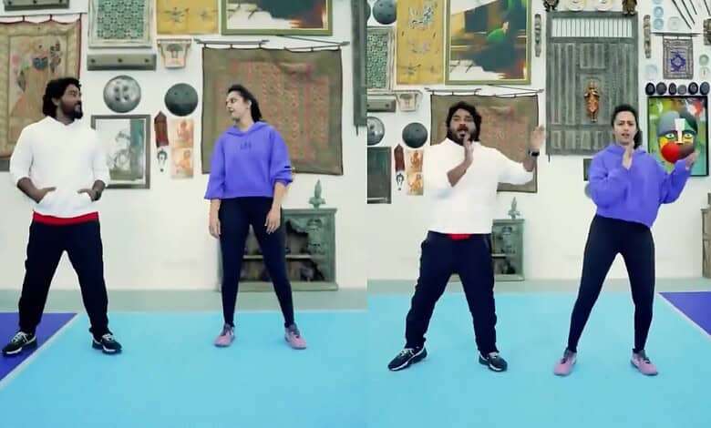 Four dancers performing in an art gallery with various paintings and artworks on the wall behind them.