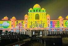 Delhi Palace illuminated during a festival with vibrant light projections.