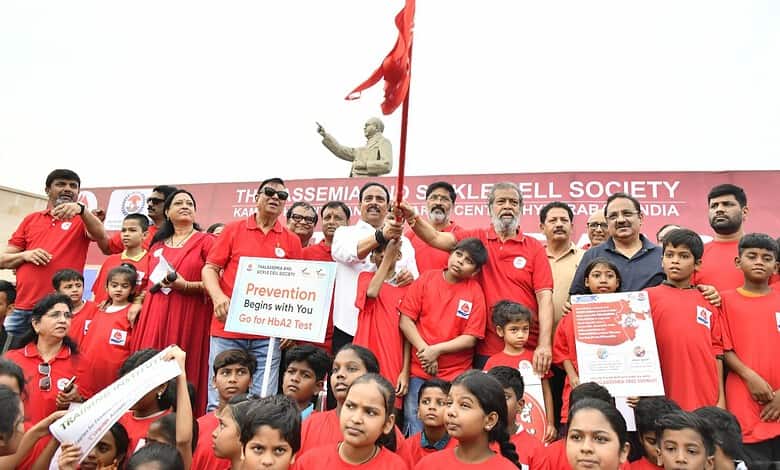 Participants in Hyderabad awareness walk for Thalassaemia Day, holding banners and raising awareness abou.