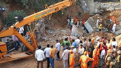 Rescue workers at collapsed bridge site in Jammu