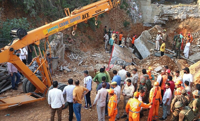 Rescue workers at collapsed bridge site in Jammu