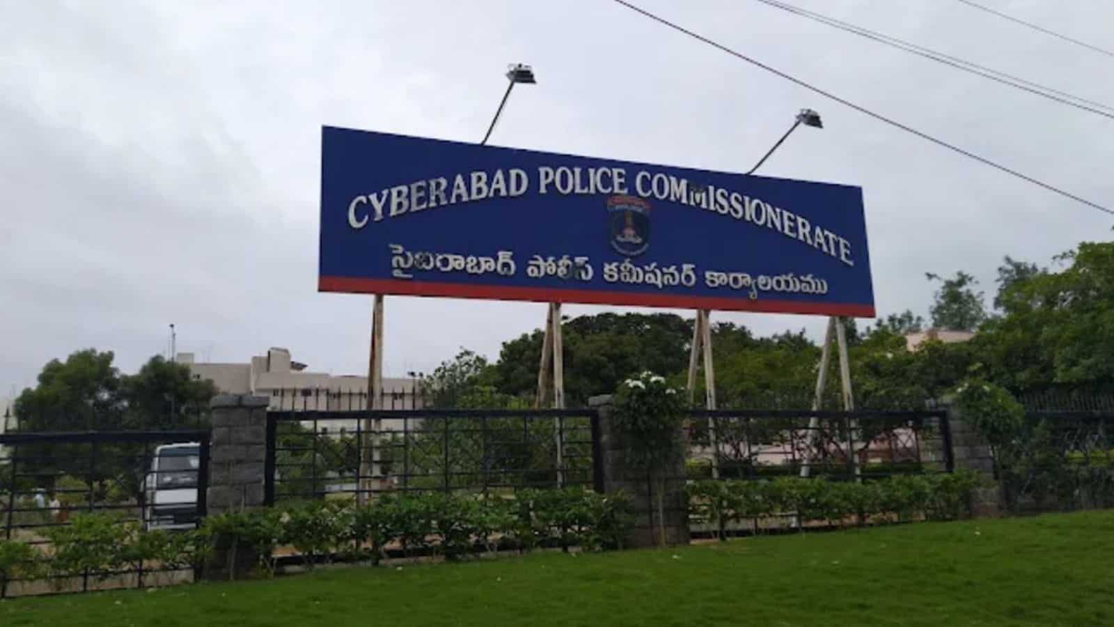 Signboard of Cyberabad Police Commissionerate with Telugu and English text.
