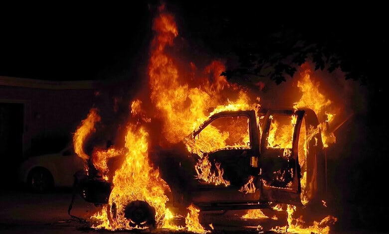 Van on fire after being set ablaze by Hindutva mob in Odisha, driver escapes the scene.
