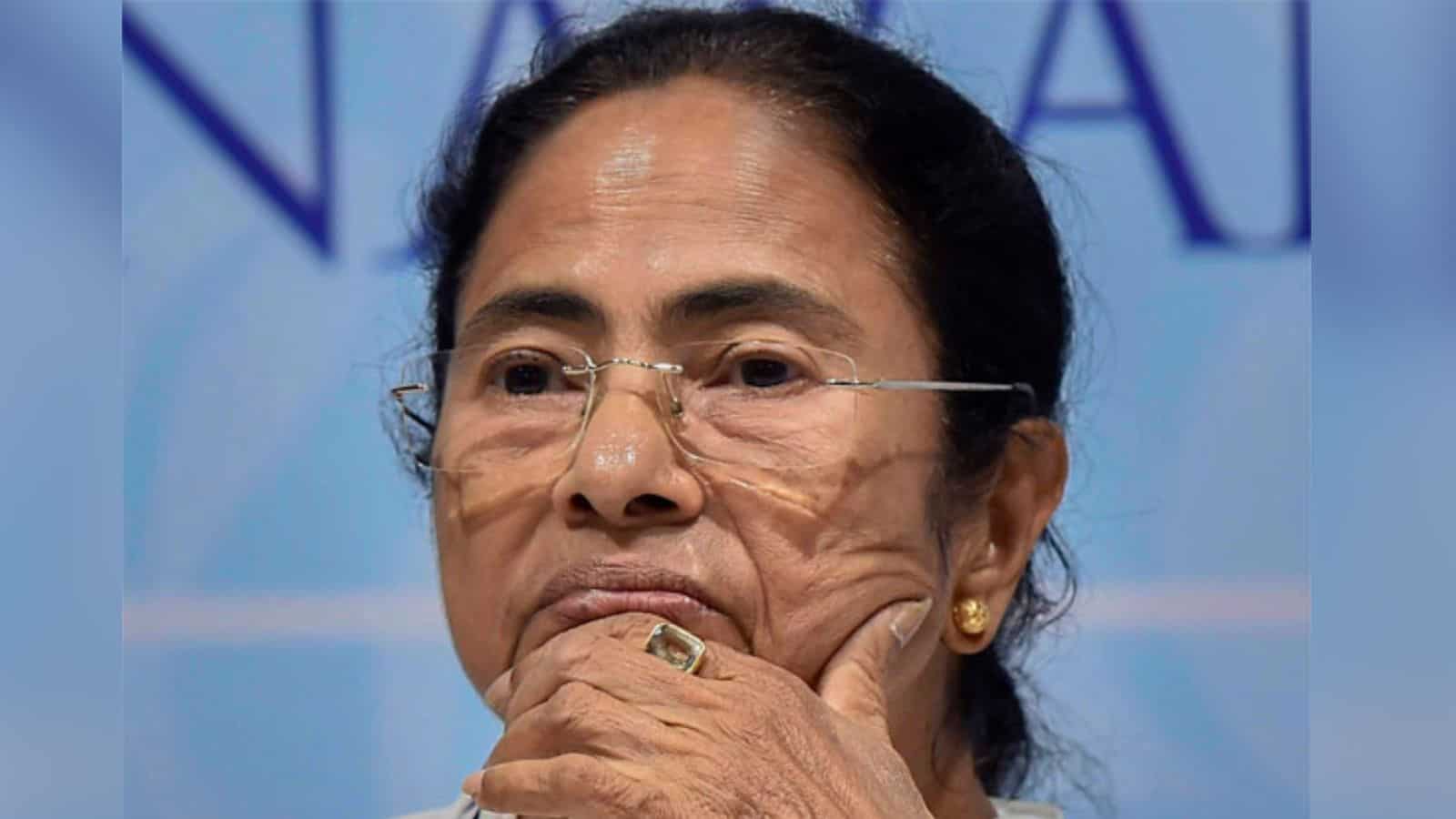 An image of Mamata Banerjee with a serious expression, highlighting political tensions during the assembl.