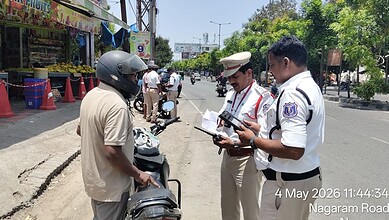 Malkajgiri Traffic police inspect the documents of a person's vehicle