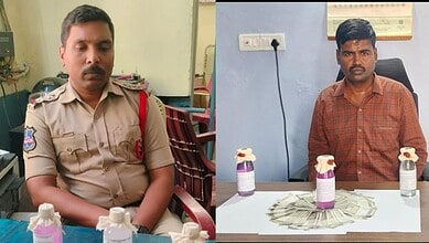 Police officer accepting bribe from government officials during Telangana ACB raid.