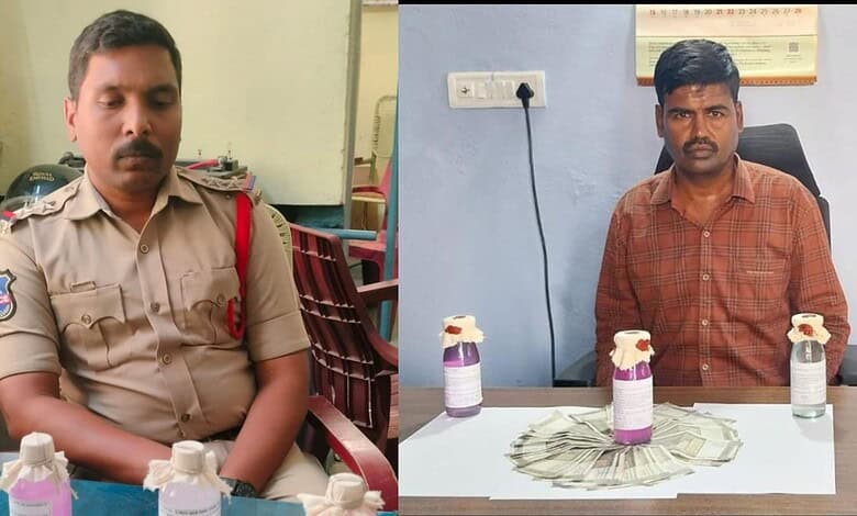 Police officer accepting bribe from government officials during Telangana ACB raid.