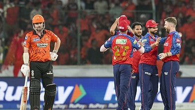 Sunrisers Hyderabad players Klaasen and Kishan celebrating on the field during IPL match.